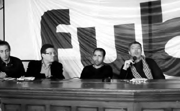 Giordano haciendo uso de la palabra en la charla “180 días de Macri” en Económicas