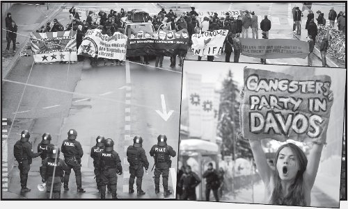 Manifestacin contra los poderosos. Abajo: Una activista denuncia: Reunin de Gangsters en Davos